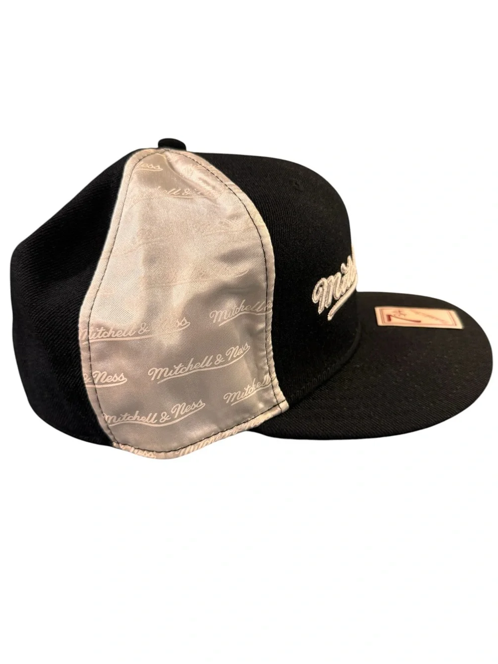 7 3/4 Mitchell & Ness Black and White with Satin sides.